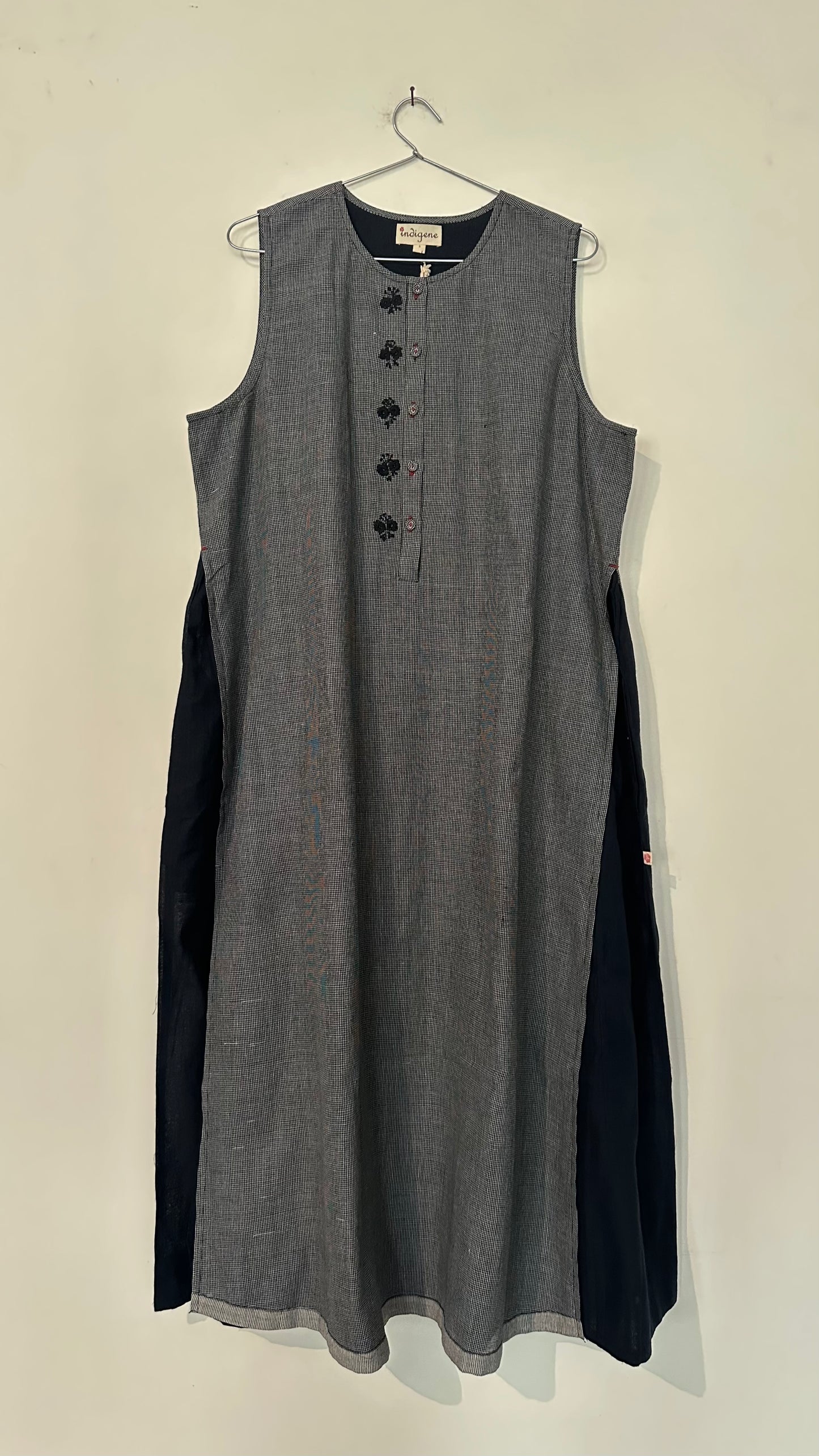 Aura layered dress with embroidered details.