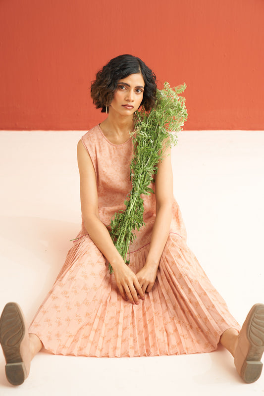 Pleated hem dress in a soft pink color, featuring a hand block printed design , perfect summer dress