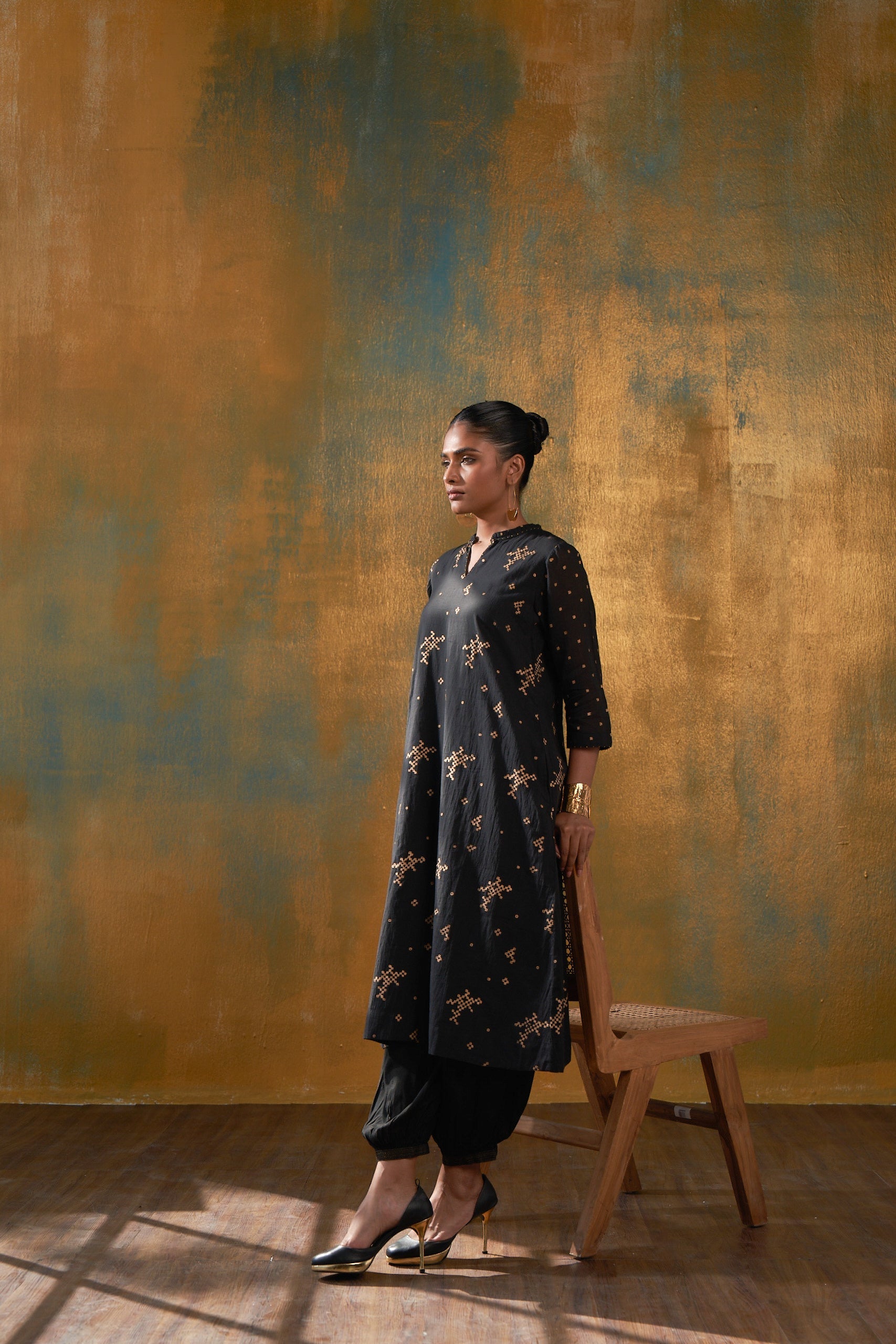 Make a statement in this classic black kurta in Hand block gold khari print and sparkle in the crowd.