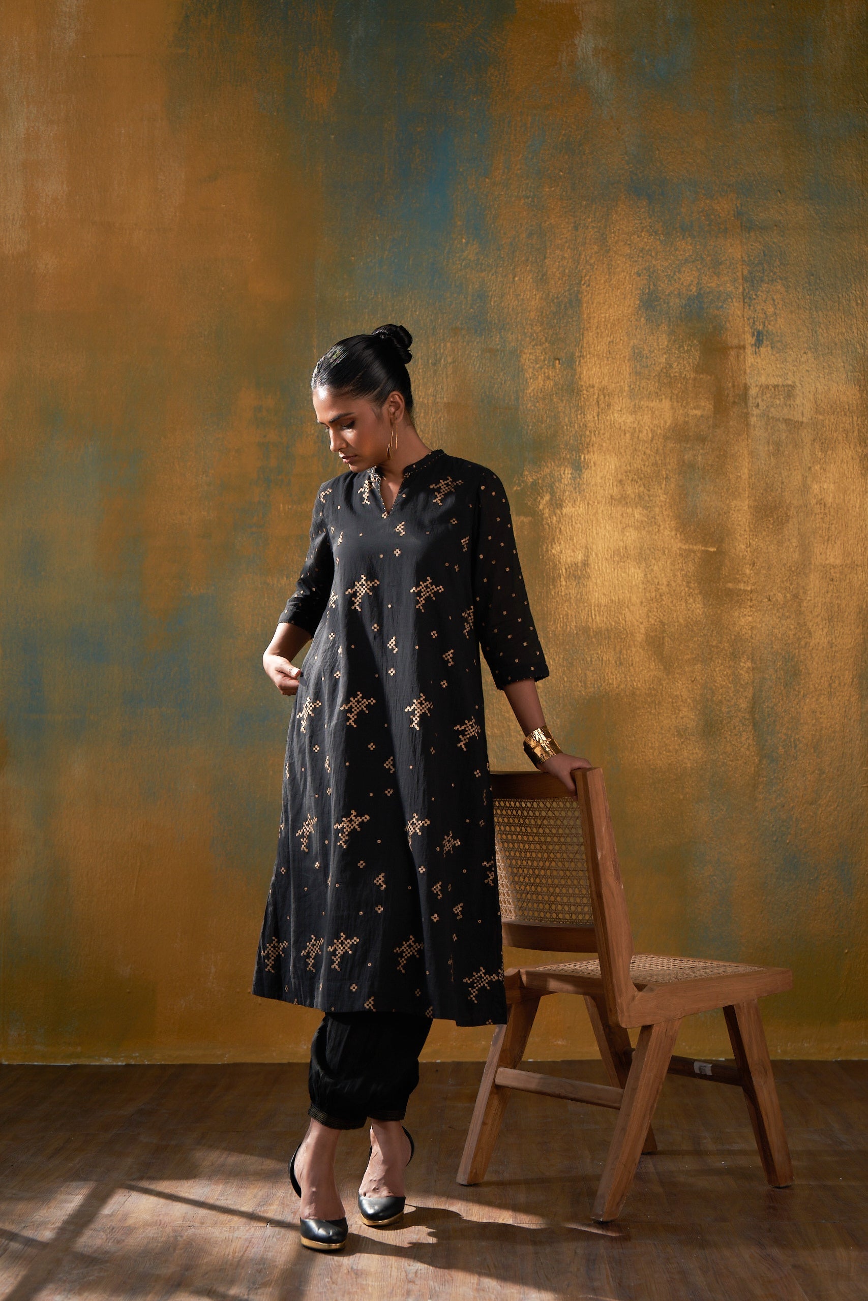 Make a statement in this classic black kurta in Hand block gold khari print and sparkle in the crowd.