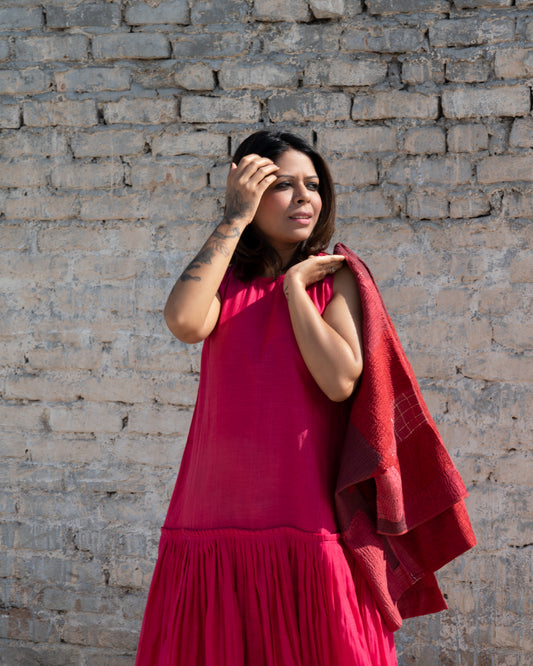 Fuschia silk cotton sleeveless dress with pleated skirt detail.