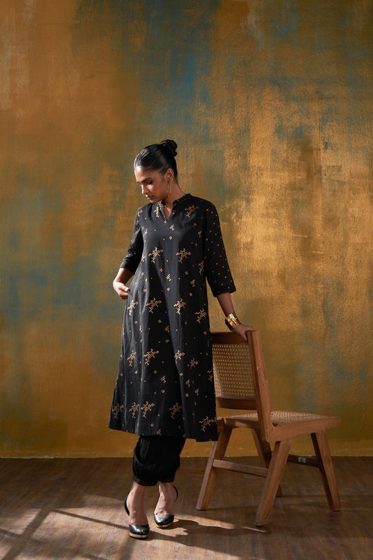 Make a statement in this classic black kurta in Hand block gold khari print and sparkle in the crowd. 